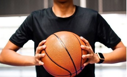 Person holding basketball
