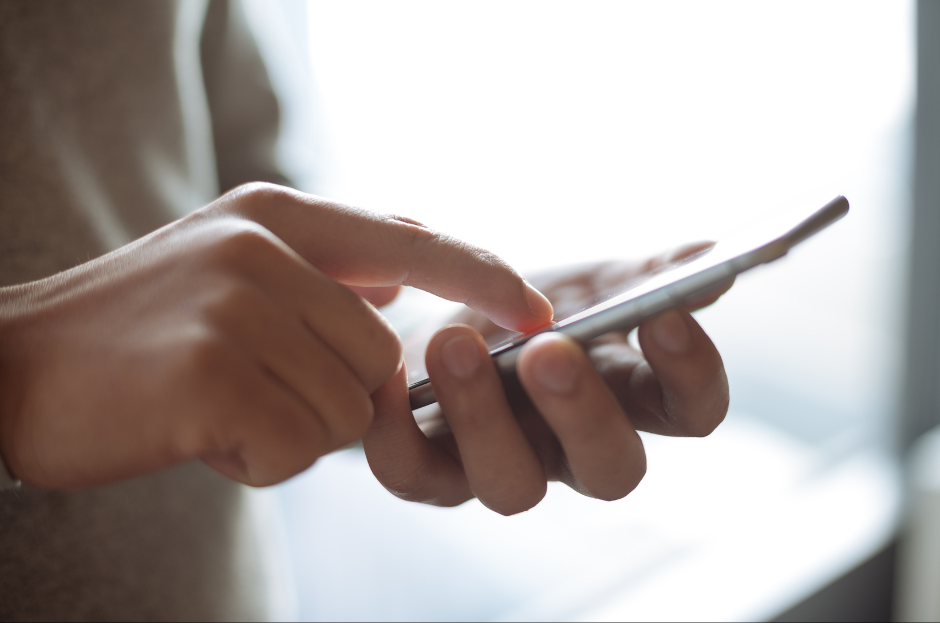 Person texting on cell phone